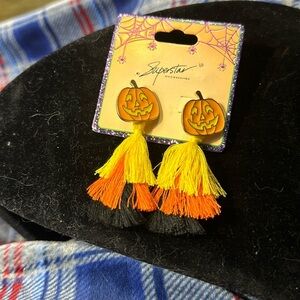 Halloween earrings, pierced. Adorable happy pumpkin, holding tassels​